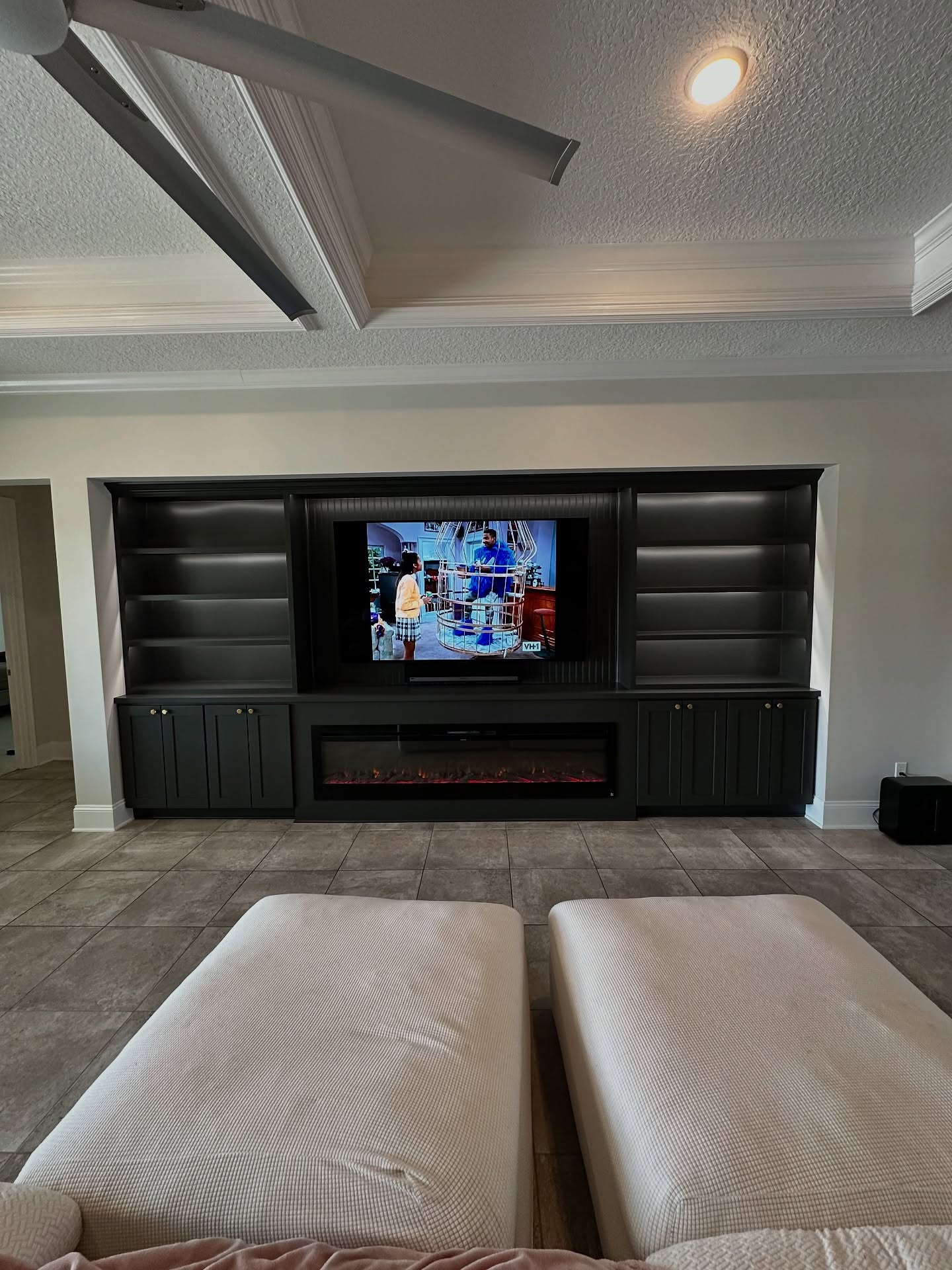 Wall-mounted TV with under-cabinet storage by AVP Construction JAX — Jacksonville & St. John's County, FL