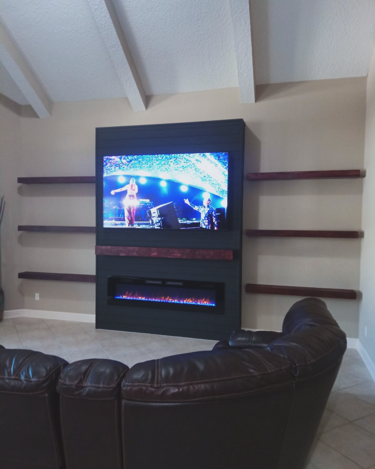 Modern entertainment center with electric fireplace by AVP Construction JAX — Jacksonville & St. John's County, FL