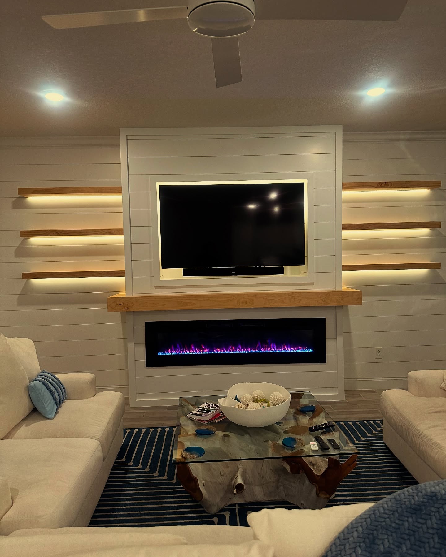 Built-in TV cabinet flanked by display shelving by AVP Construction JAX — Jacksonville & St. John's County, FL