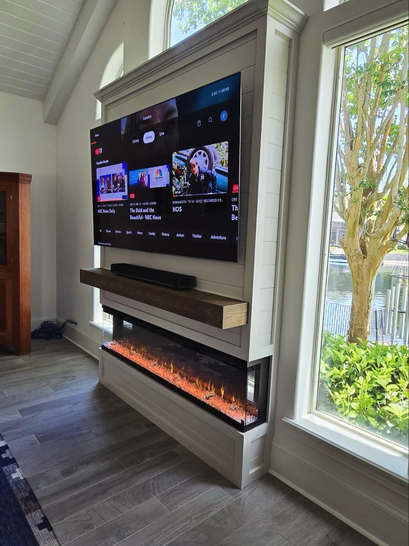 Floor-to-ceiling media wall with custom millwork by AVP Construction JAX — Jacksonville & St. John's County, FL