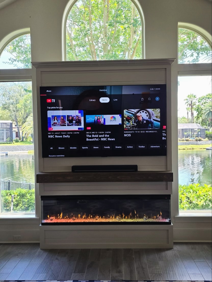 Modern entertainment center with electric fireplace by AVP Construction JAX — Jacksonville & St. John's County, FL