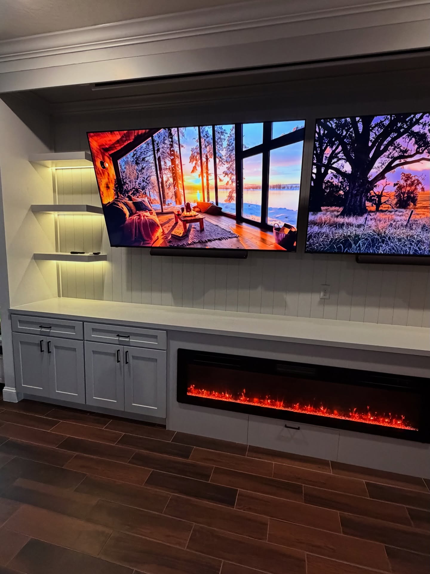 Wall-mounted TV with under-cabinet storage by AVP Construction JAX — Jacksonville & St. John's County, FL