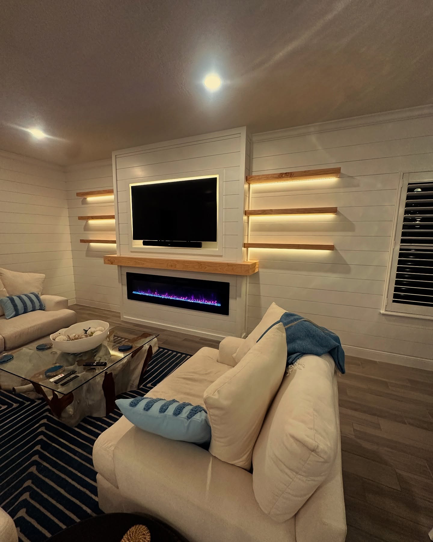 Slat-wall TV feature with hidden wiring by AVP Construction JAX — Jacksonville & St. John's County, FL