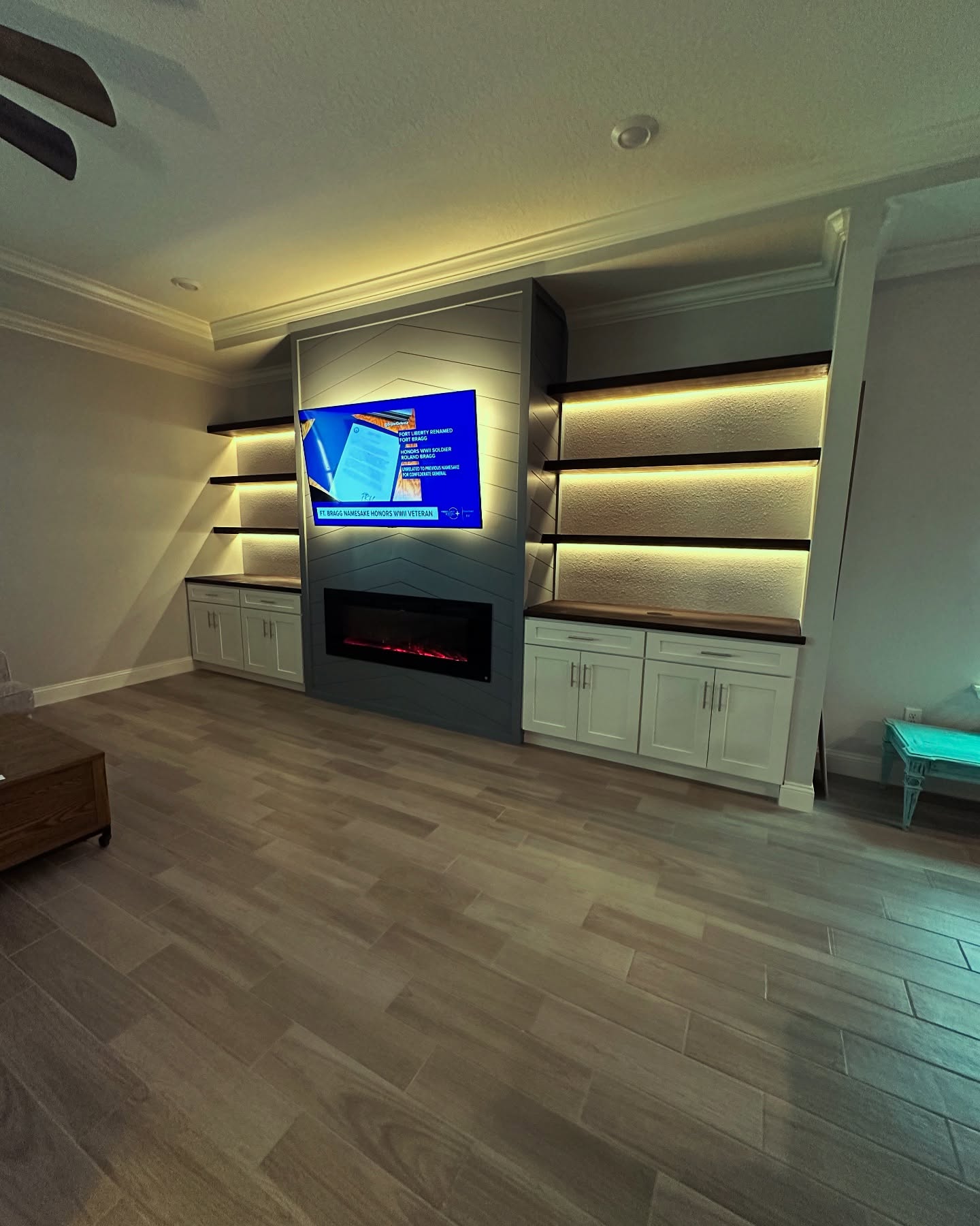 Floor-to-ceiling media wall with custom millwork by AVP Construction JAX — Jacksonville & St. John's County, FL