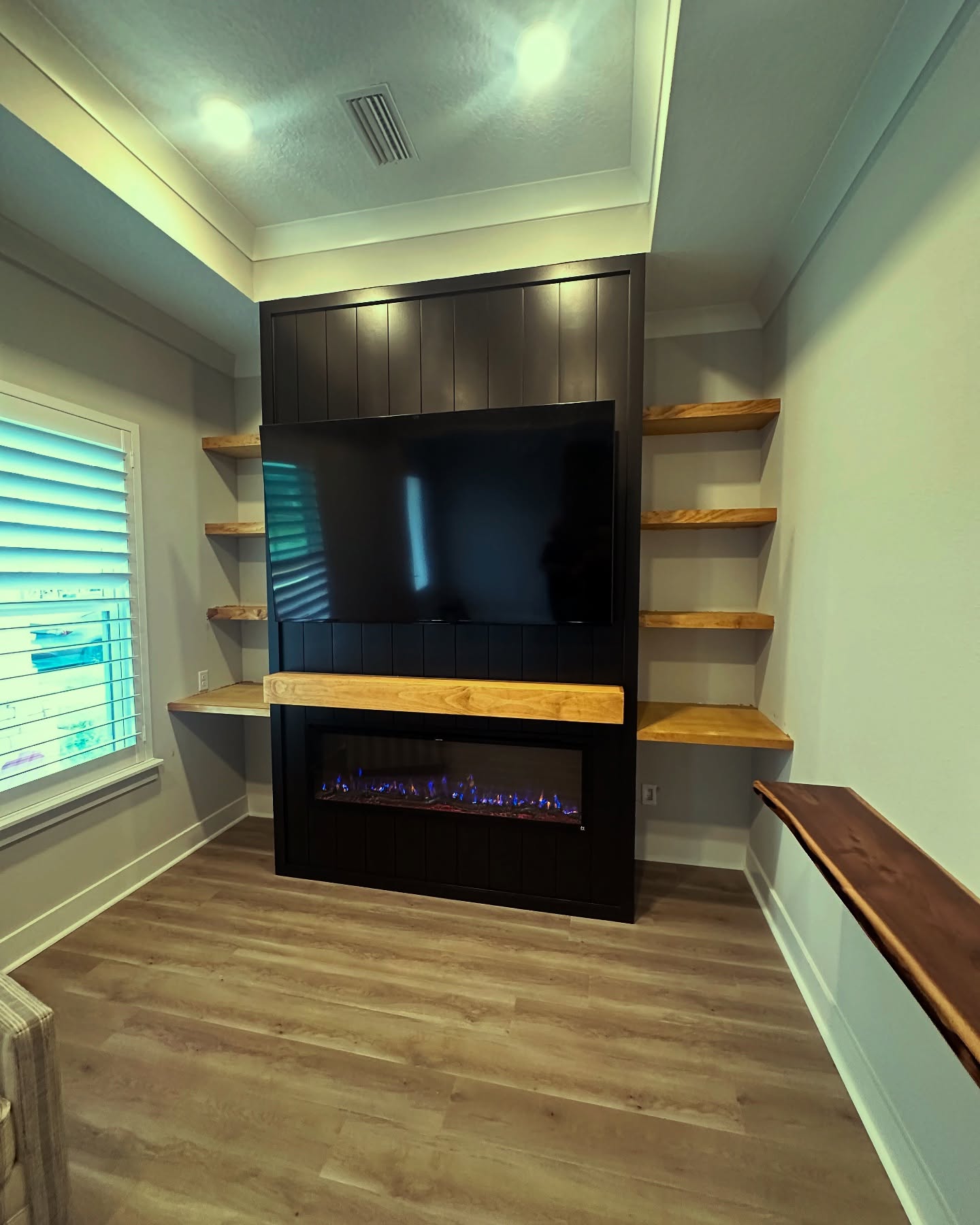 Floating-shelf TV built-in with shaker cabinets by AVP Construction JAX — Jacksonville & St. John's County, FL