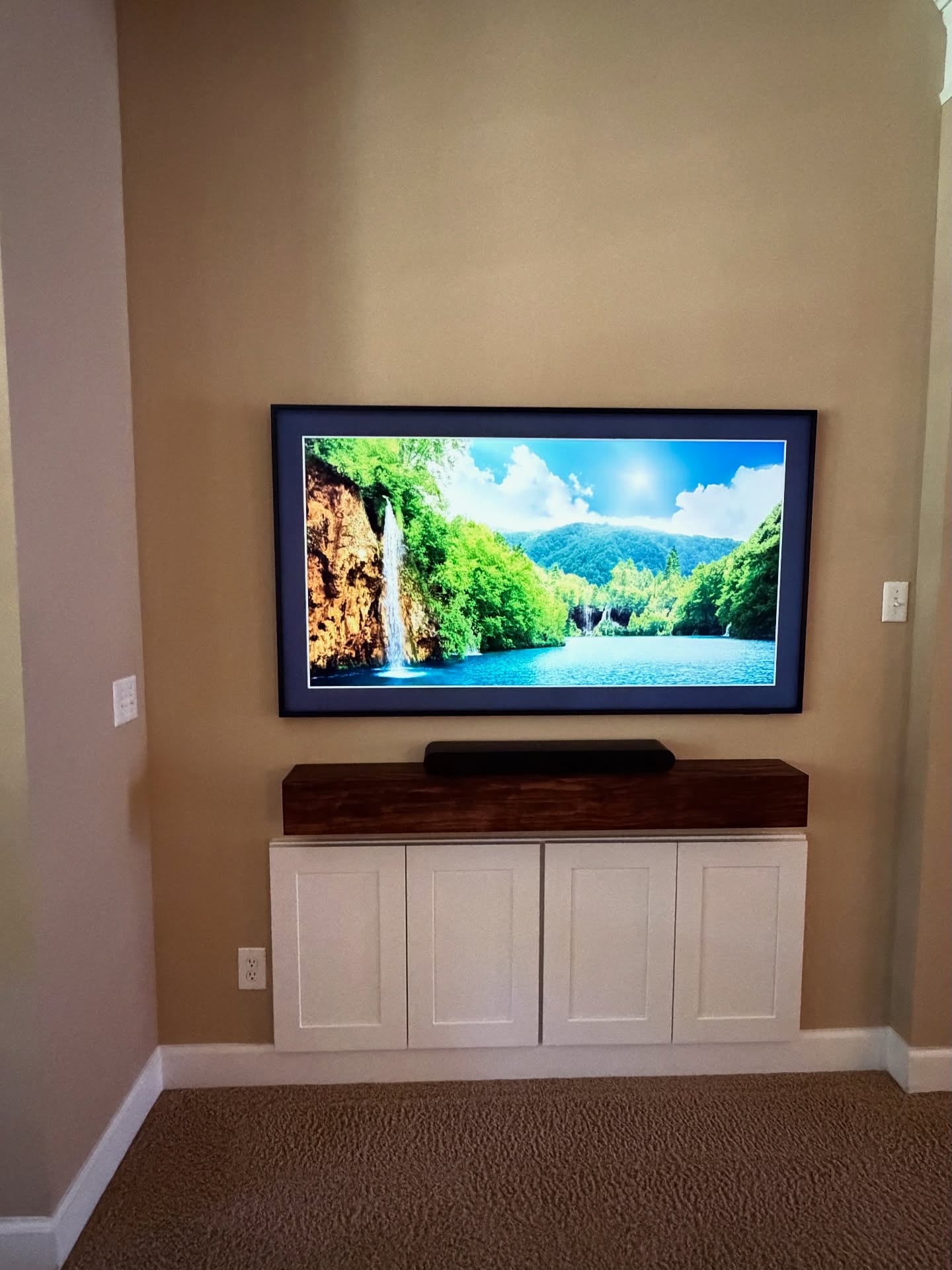 Floor-to-ceiling media wall with custom millwork by AVP Construction JAX — Jacksonville & St. John's County, FL