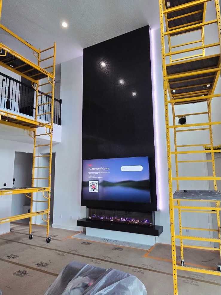 Wall-mounted TV with under-cabinet storage by AVP Construction JAX — Jacksonville & St. John's County, FL