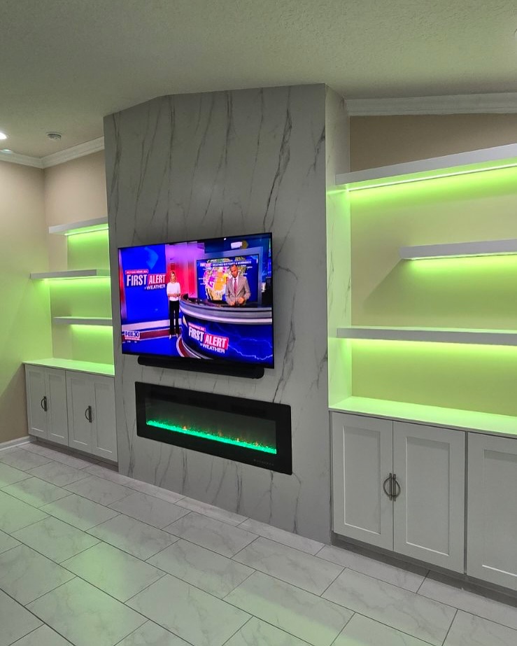 Custom living-room media wall with paneling by AVP Construction JAX — Jacksonville & St. John's County, FL