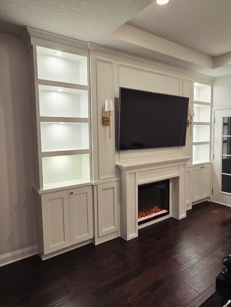 Floor-to-ceiling media wall with custom millwork by AVP Construction JAX — Jacksonville & St. John's County, FL