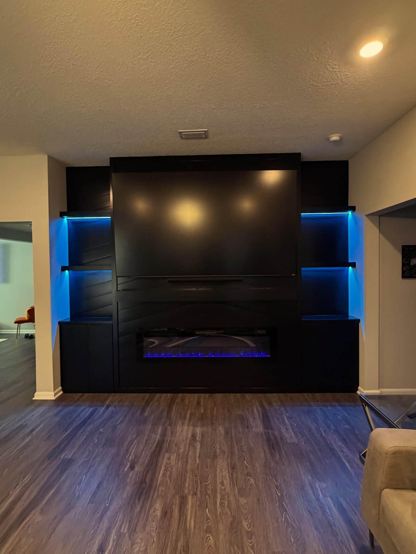 Floating-shelf TV built-in with shaker cabinets by AVP Construction JAX — Jacksonville & St. John's County, FL