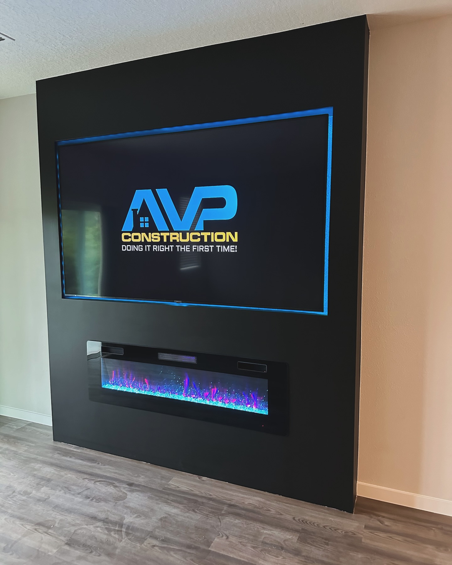 Wall-mounted TV with under-cabinet storage by AVP Construction JAX — Jacksonville & St. John's County, FL