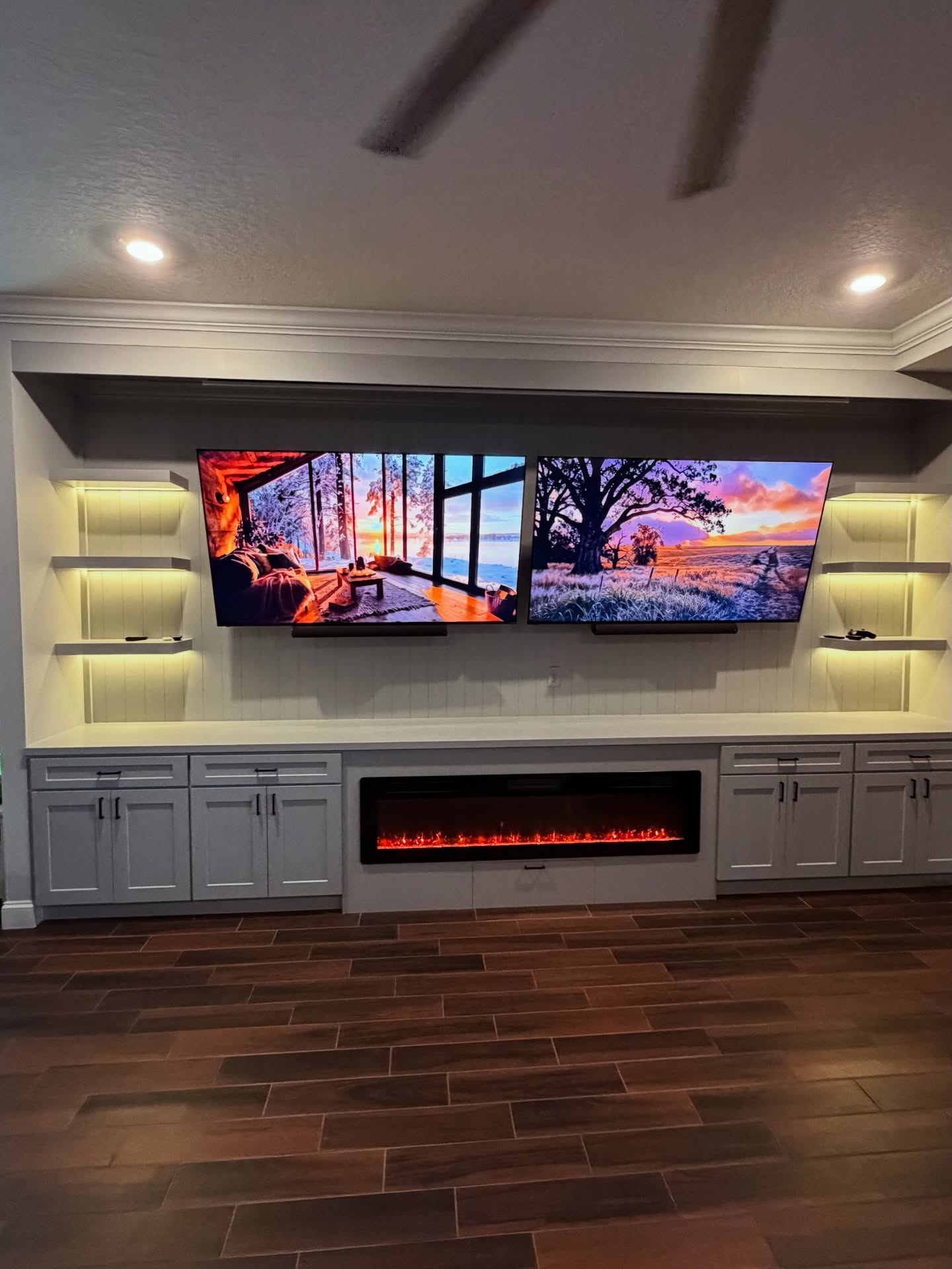 Built-in TV cabinet flanked by display shelving by AVP Construction JAX — Jacksonville & St. John's County, FL