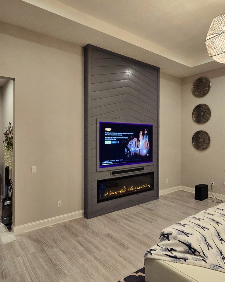 Custom living-room media wall with paneling by AVP Construction JAX — Jacksonville & St. John's County, FL