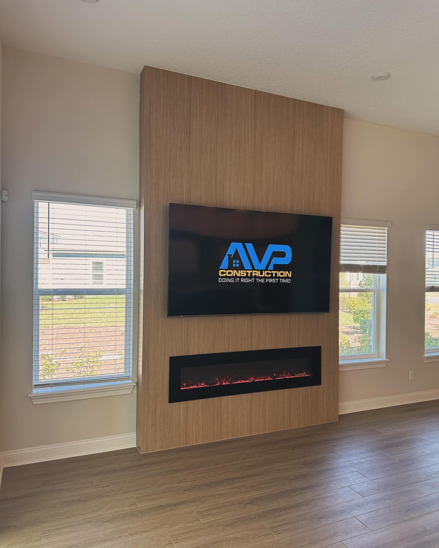 Slat-wall TV feature with hidden wiring by AVP Construction JAX — Jacksonville & St. John's County, FL
