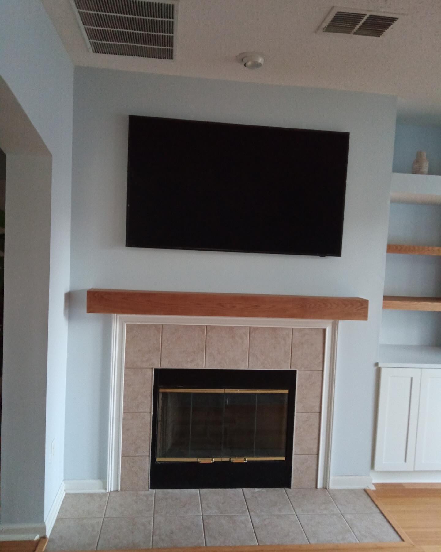 Custom living-room media wall with paneling by AVP Construction JAX — Jacksonville & St. John's County, FL