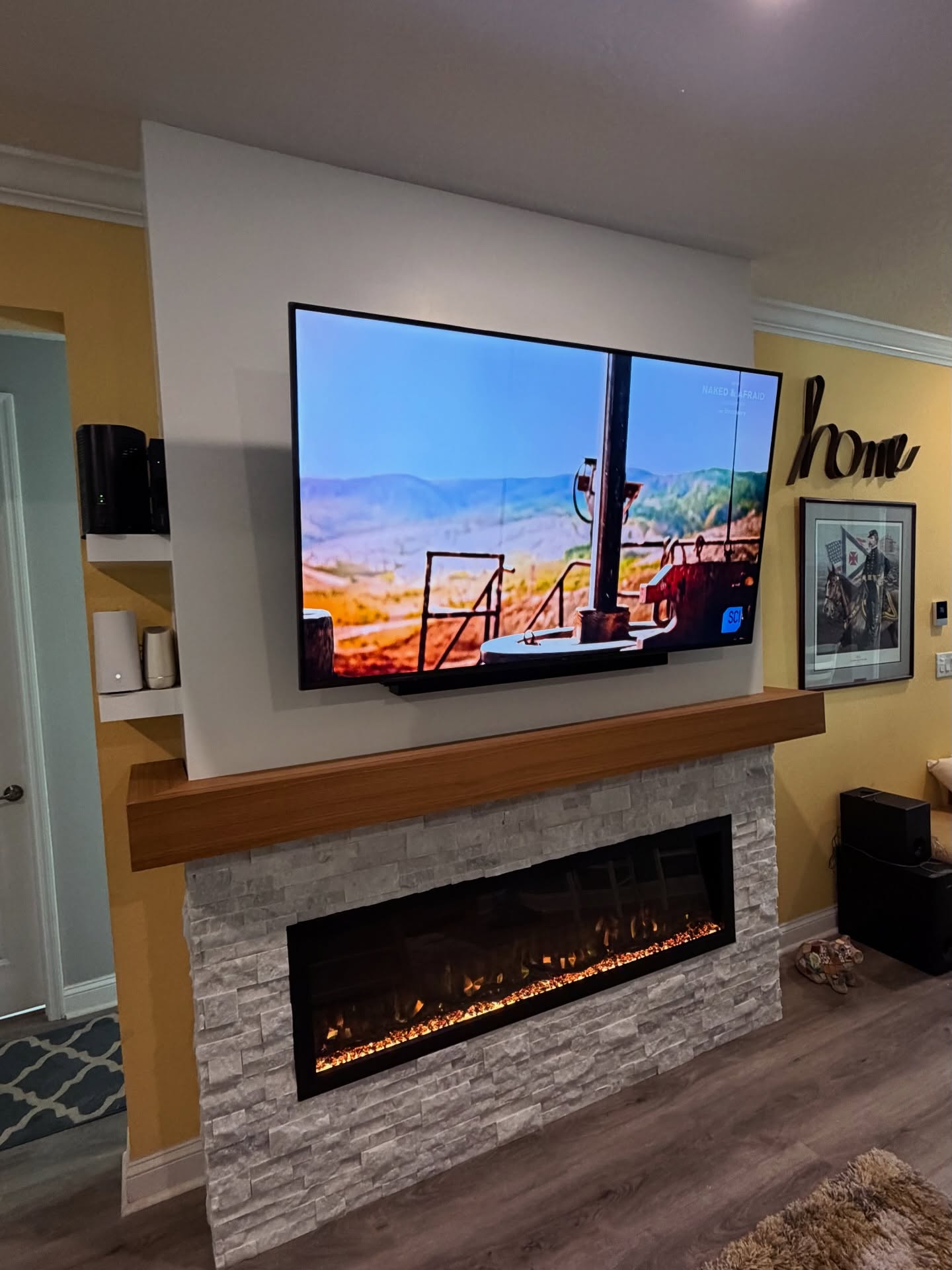 Slat-wall TV feature with hidden wiring by AVP Construction JAX — Jacksonville & St. John's County, FL
