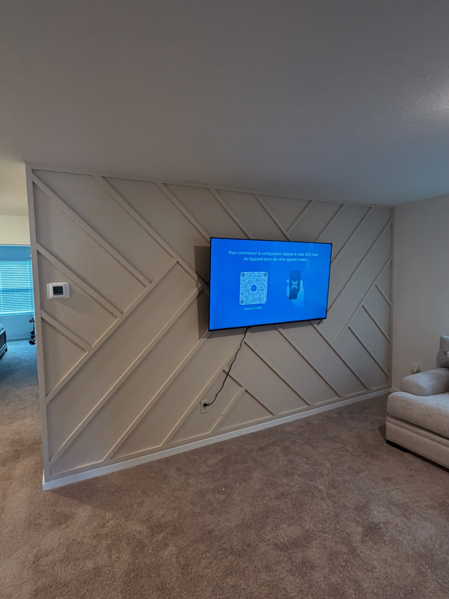 Wall-mounted TV with under-cabinet storage by AVP Construction JAX — Jacksonville & St. John's County, FL