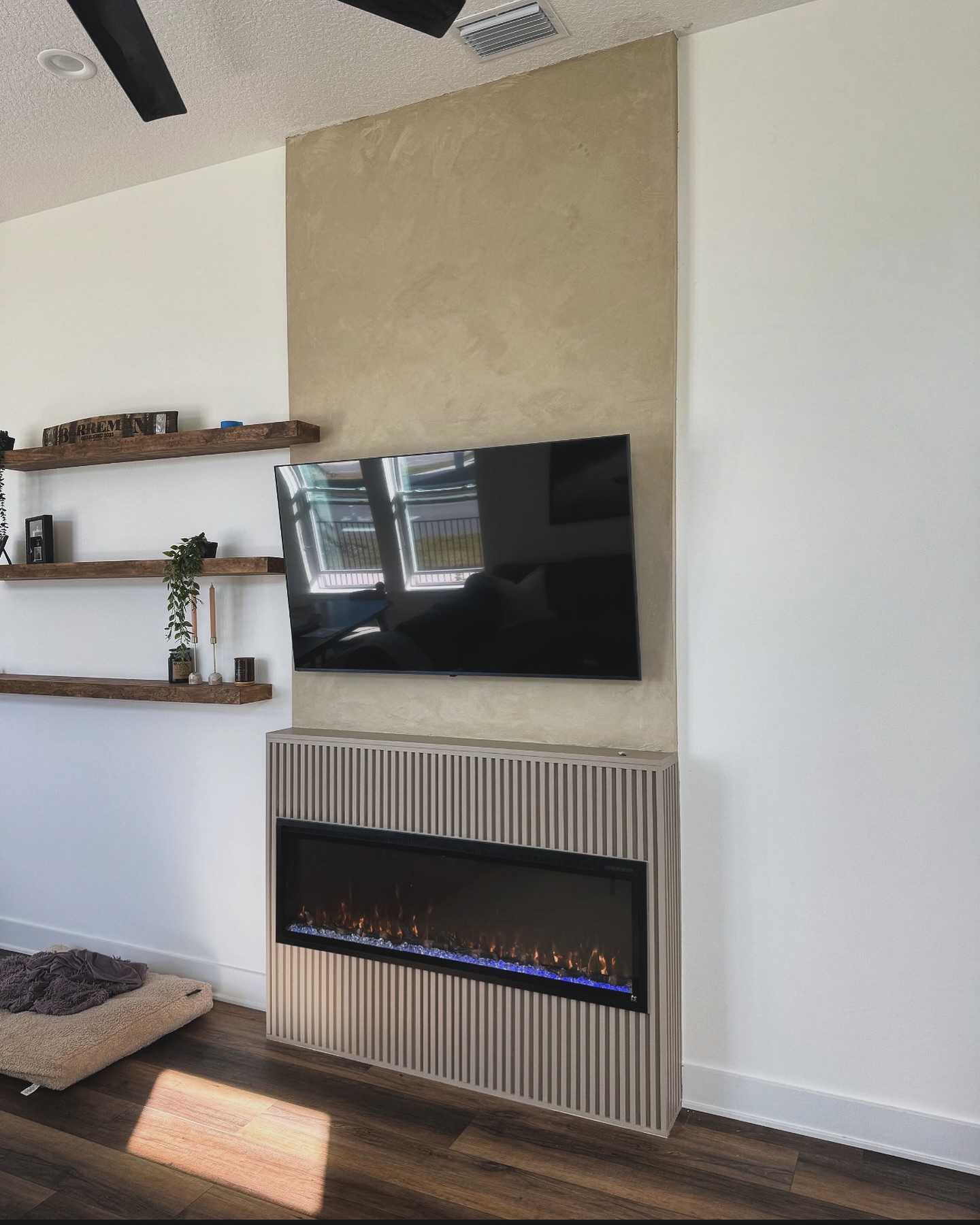 Modern entertainment center with electric fireplace by AVP Construction JAX — Jacksonville & St. John's County, FL