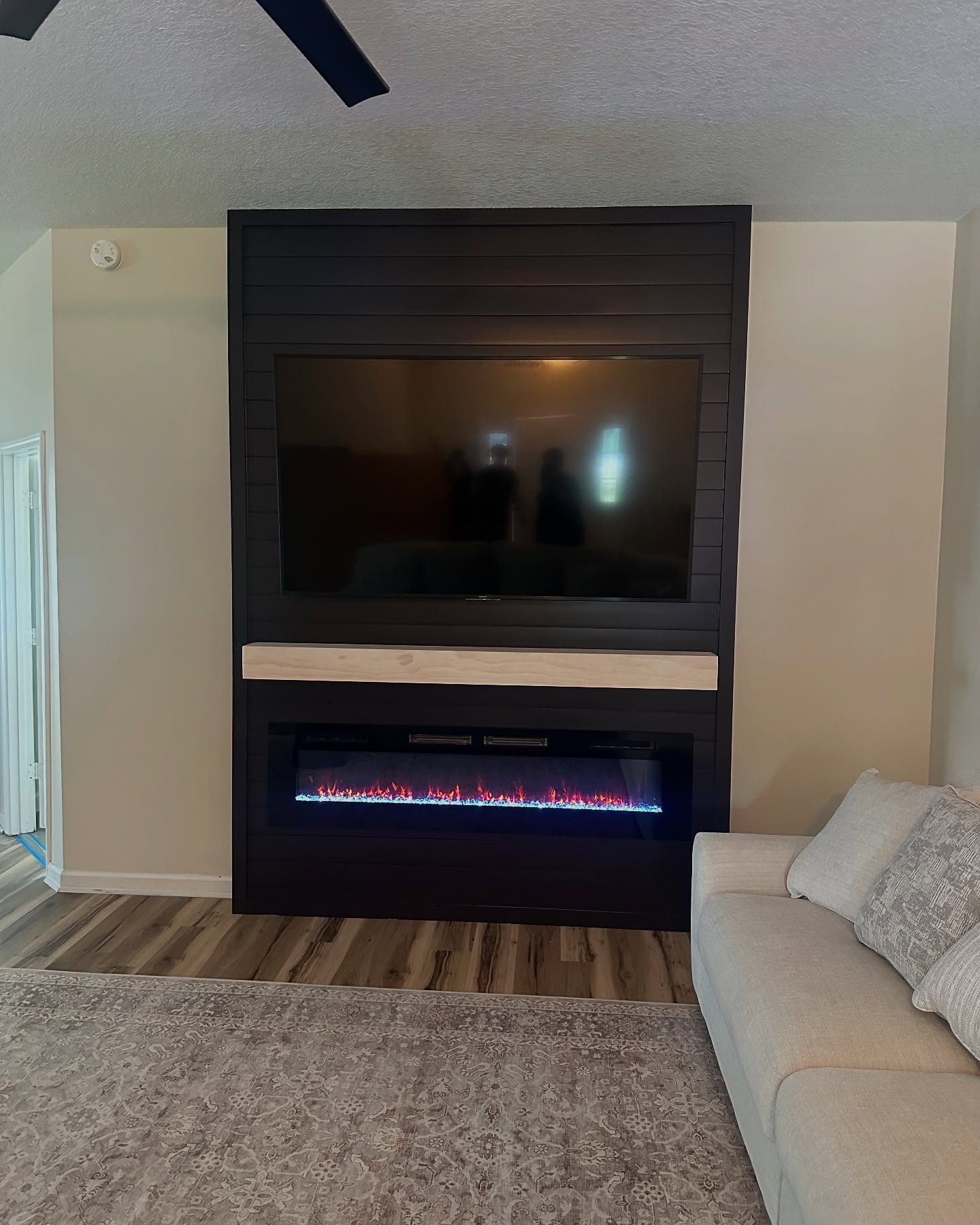 Slat-wall TV feature with hidden wiring by AVP Construction JAX — Jacksonville & St. John's County, FL