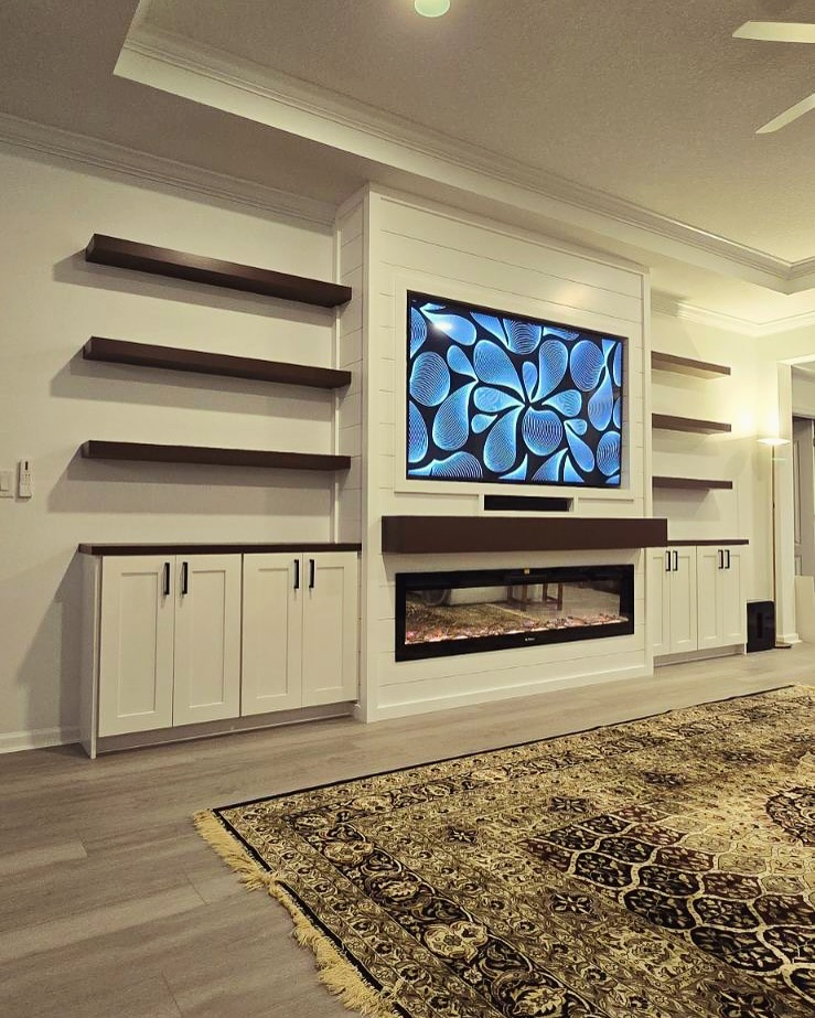 Wall-mounted TV with under-cabinet storage by AVP Construction JAX — Jacksonville & St. John's County, FL