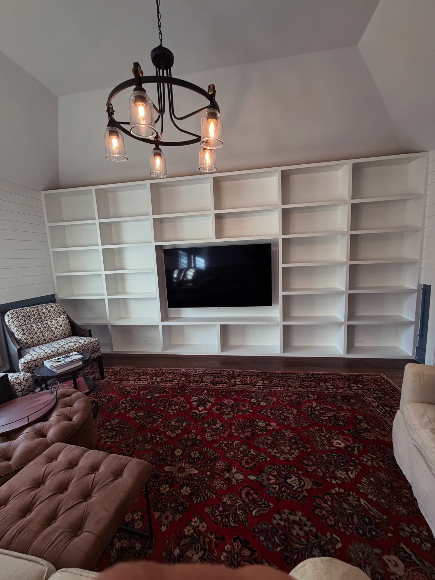 Built-in TV cabinet flanked by display shelving by AVP Construction JAX — Jacksonville & St. John's County, FL