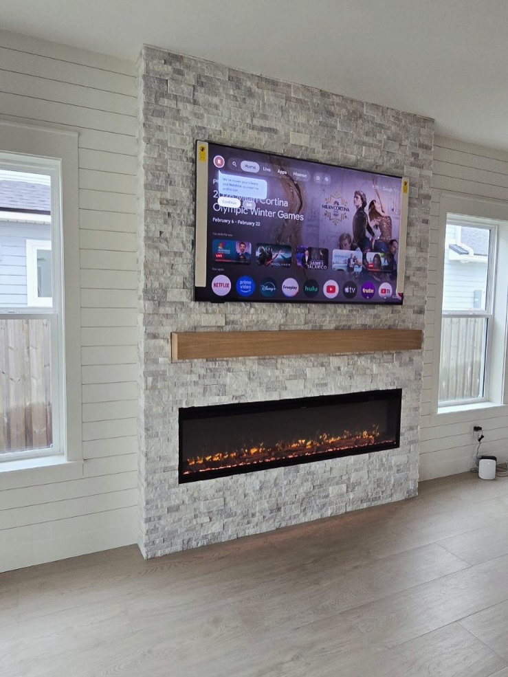Floating-shelf TV built-in with shaker cabinets by AVP Construction JAX — Jacksonville & St. John's County, FL