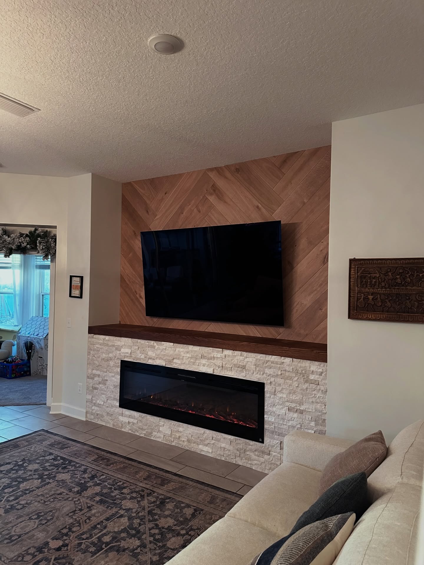 Floor-to-ceiling media wall with custom millwork by AVP Construction JAX — Jacksonville & St. John's County, FL