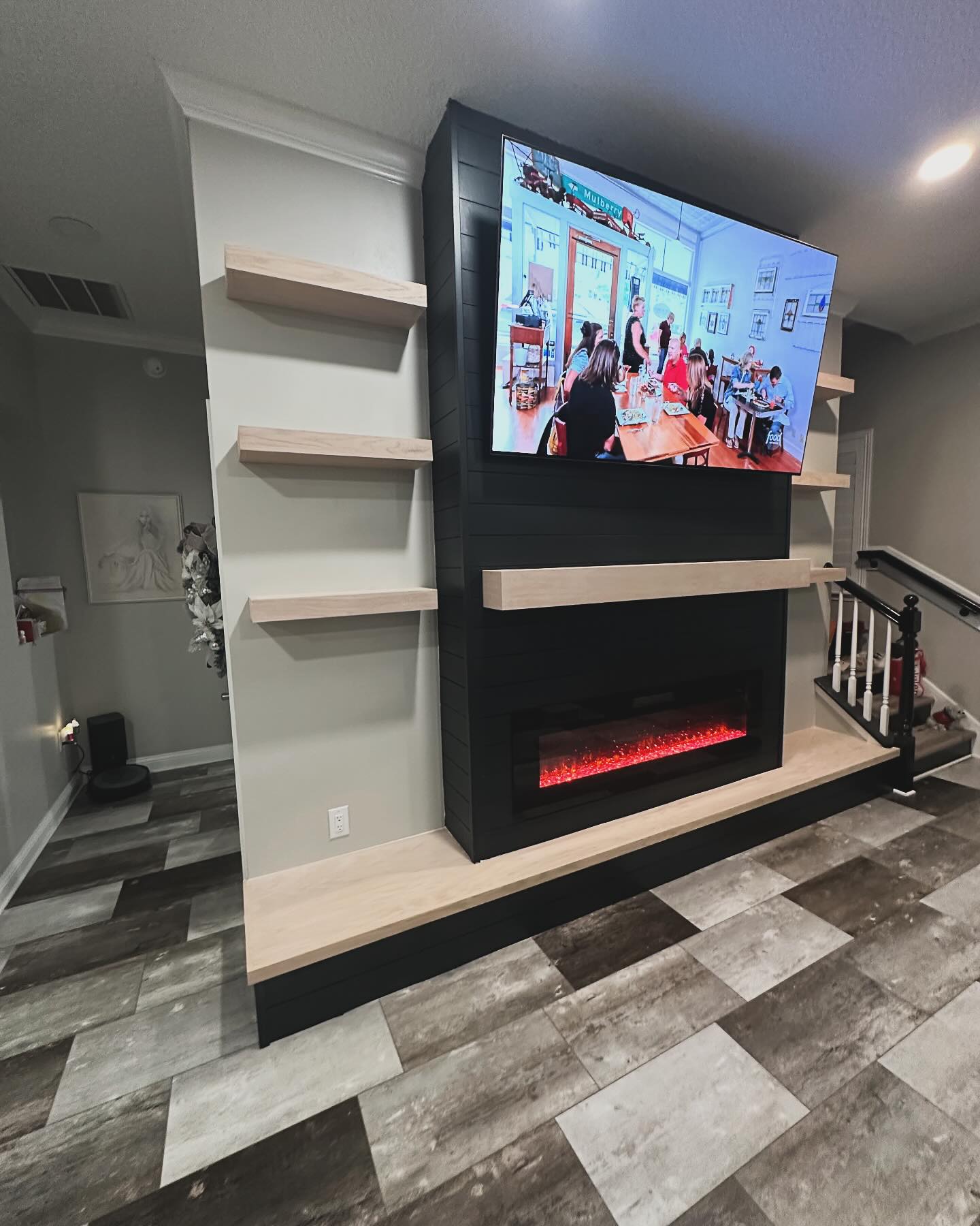 Wall-mounted TV with under-cabinet storage by AVP Construction JAX — Jacksonville & St. John's County, FL