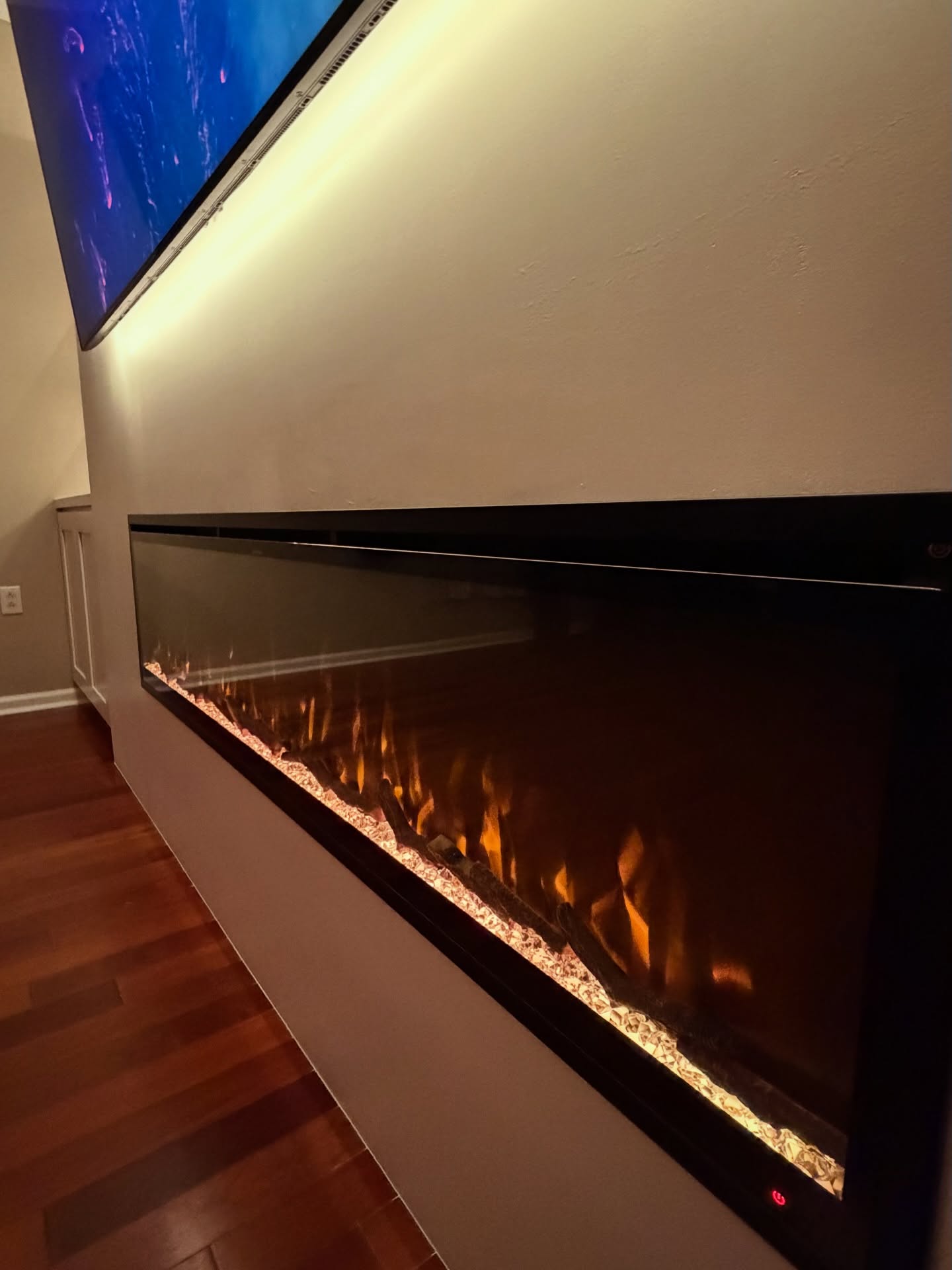 Built-in TV cabinet flanked by display shelving by AVP Construction JAX — Jacksonville & St. John's County, FL