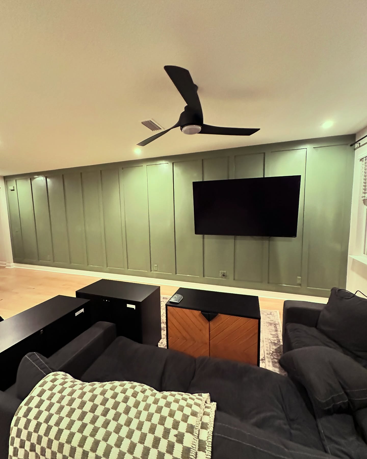 Custom living-room media wall with paneling by AVP Construction JAX — Jacksonville & St. John's County, FL