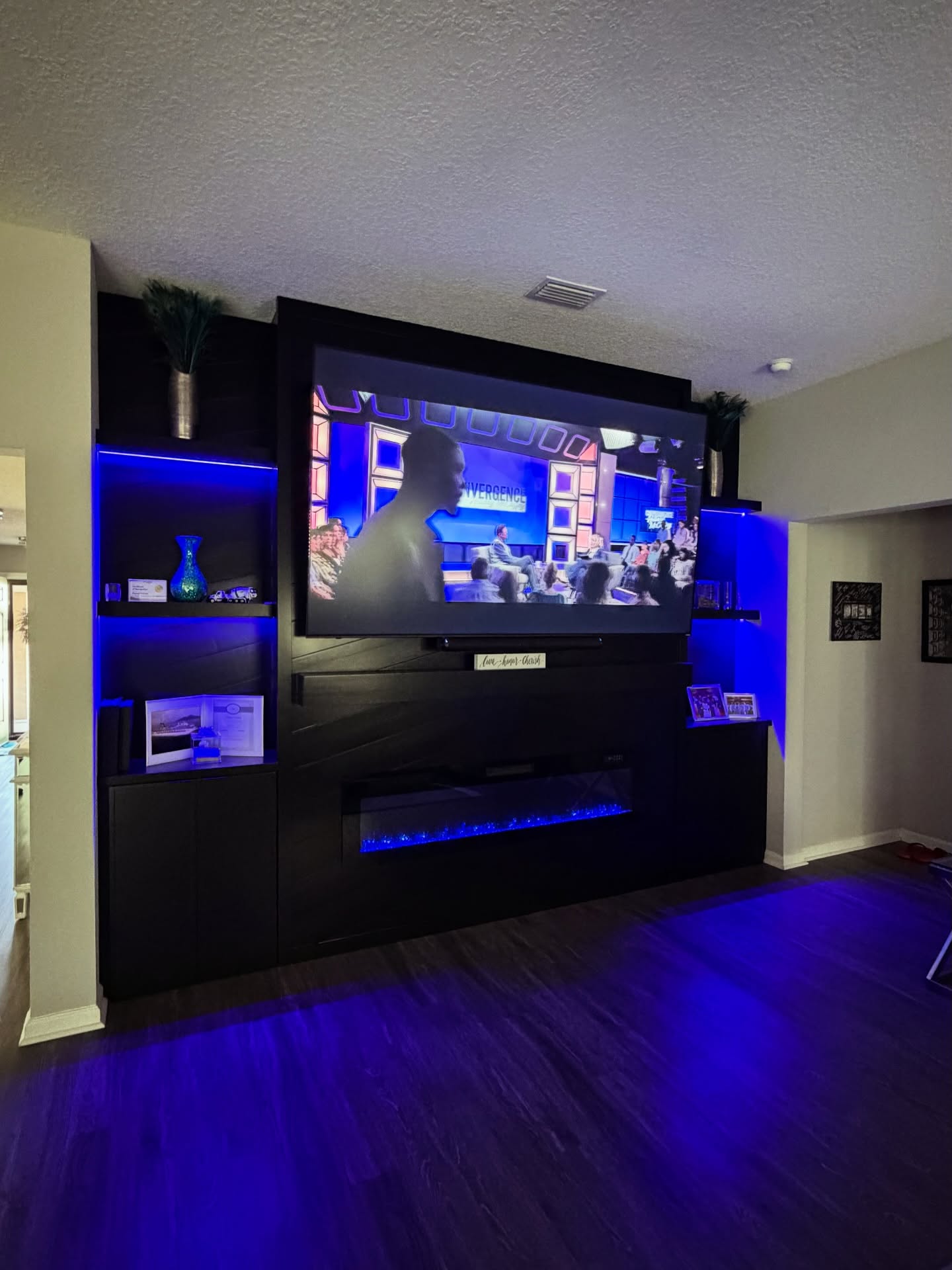 Floating-shelf TV built-in with shaker cabinets by AVP Construction JAX — Jacksonville & St. John's County, FL