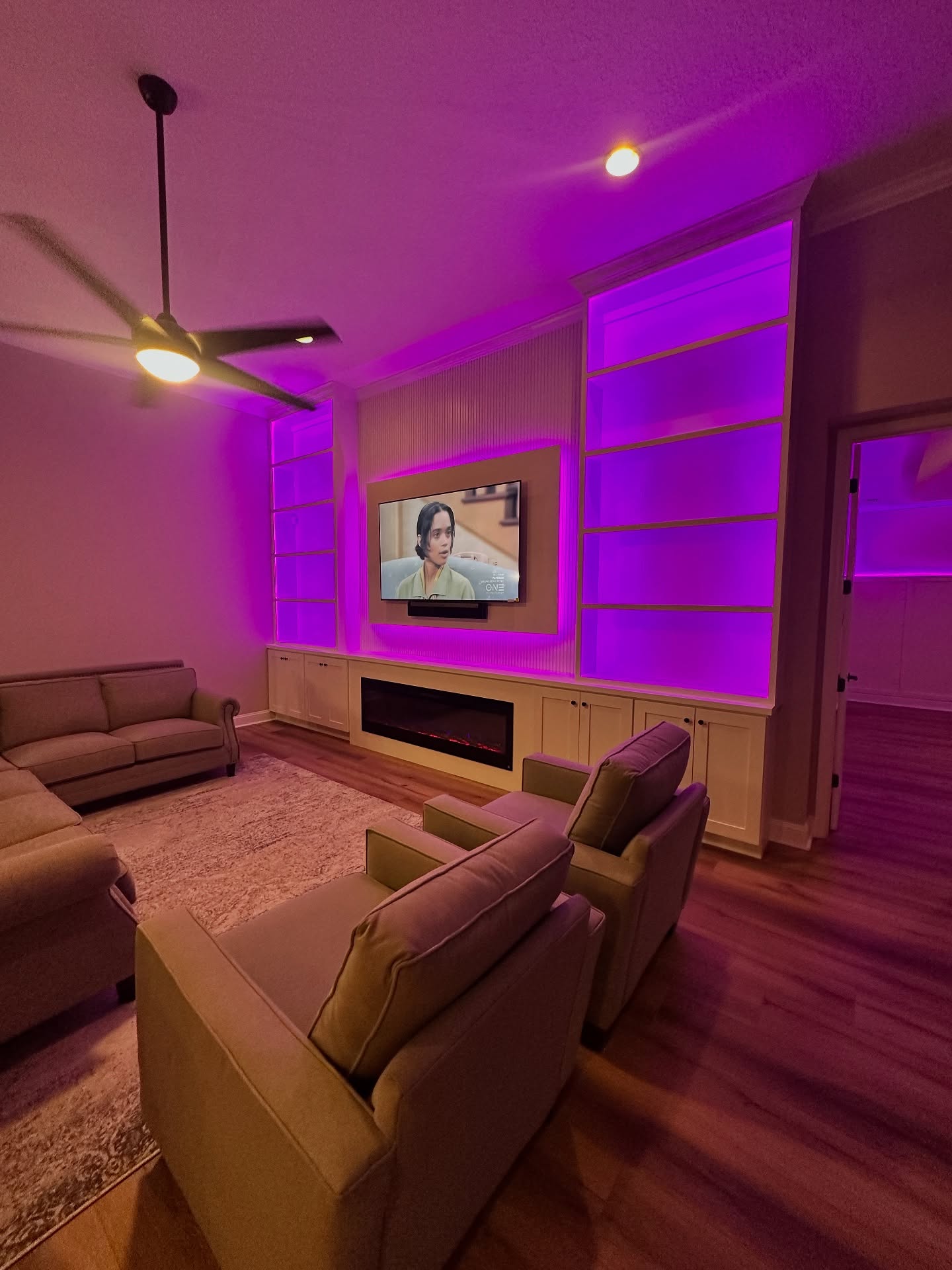 Modern entertainment center with electric fireplace by AVP Construction JAX — Jacksonville & St. John's County, FL