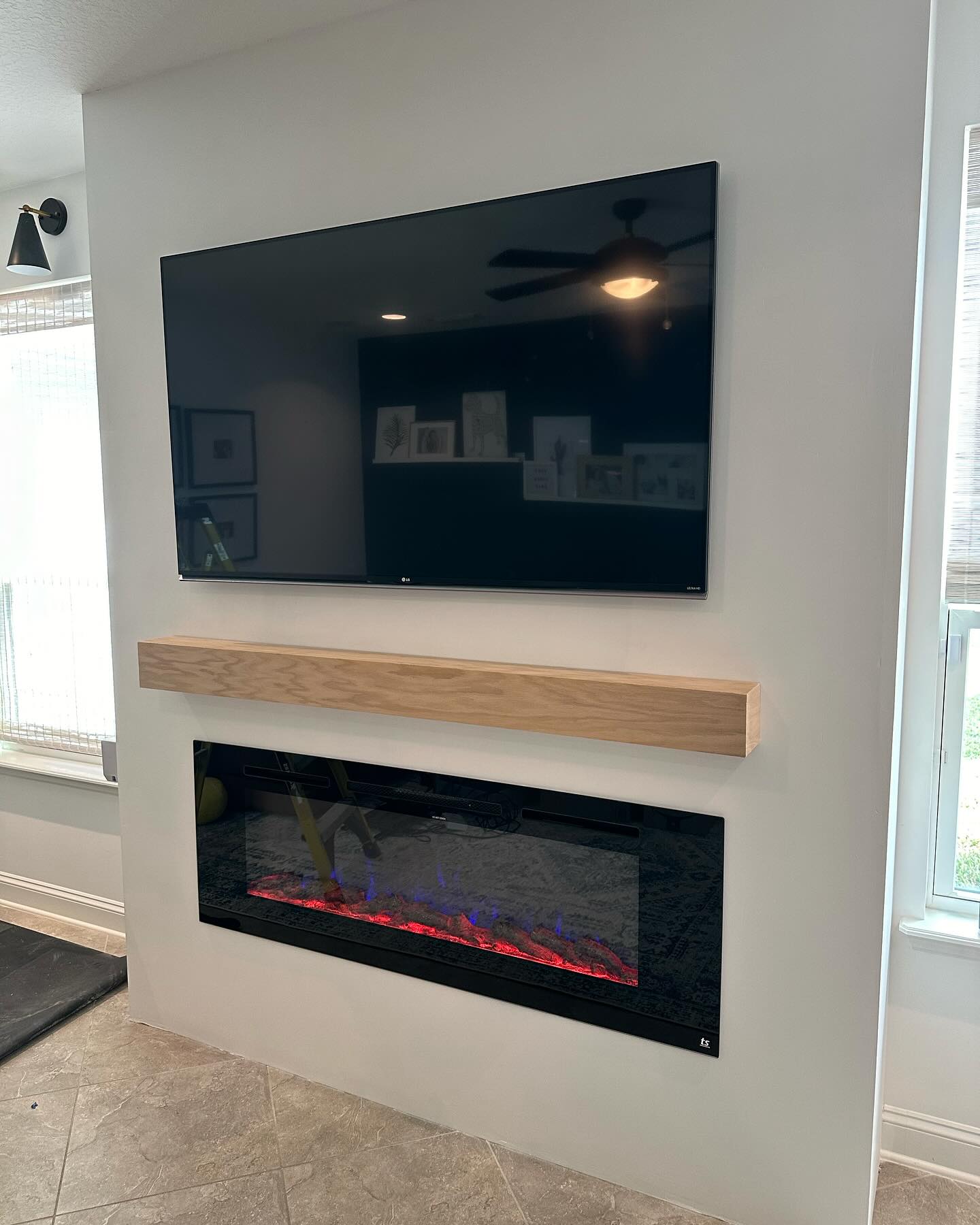 Floor-to-ceiling media wall with custom millwork by AVP Construction JAX — Jacksonville & St. John's County, FL