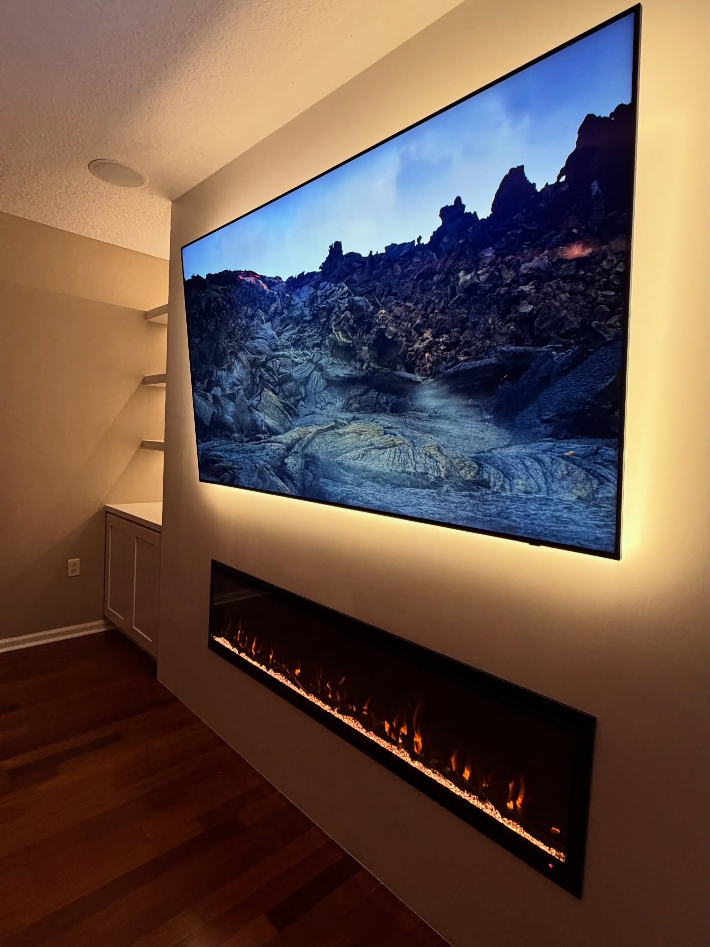 Floating-shelf TV built-in with shaker cabinets by AVP Construction JAX — Jacksonville & St. John's County, FL