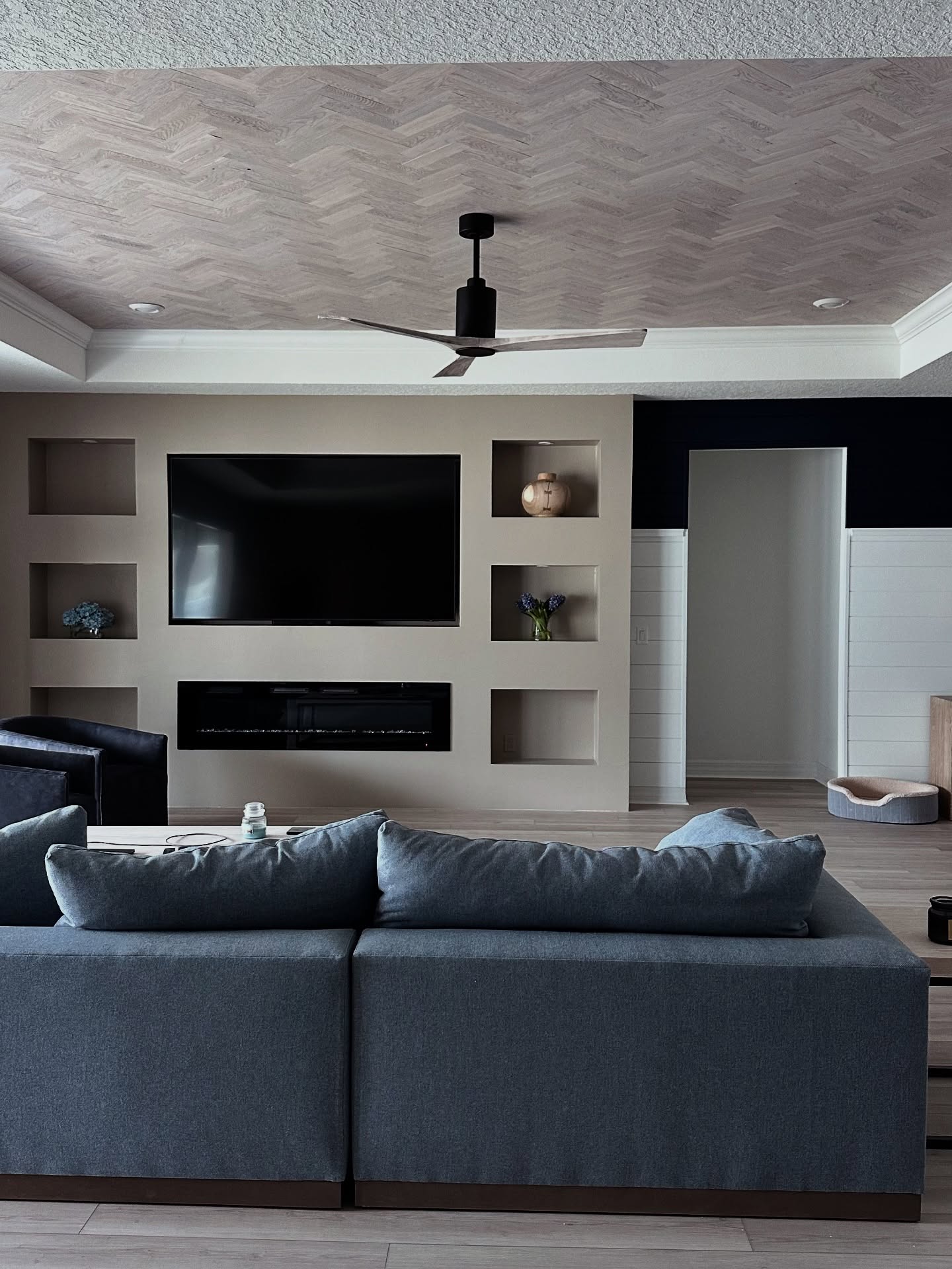 Wall-mounted TV with under-cabinet storage by AVP Construction JAX — Jacksonville & St. John's County, FL