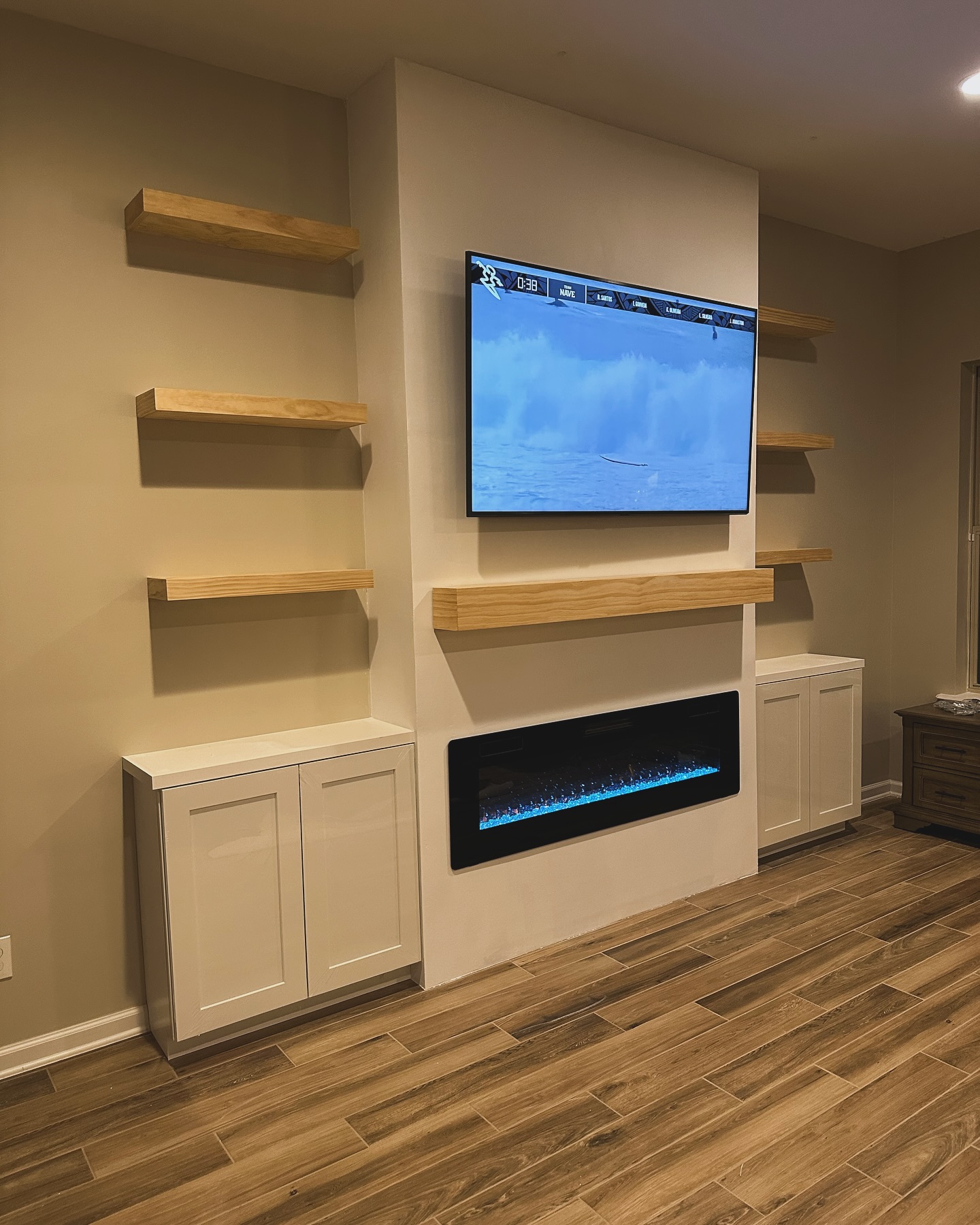 Custom living-room media wall with paneling by AVP Construction JAX — Jacksonville & St. John's County, FL