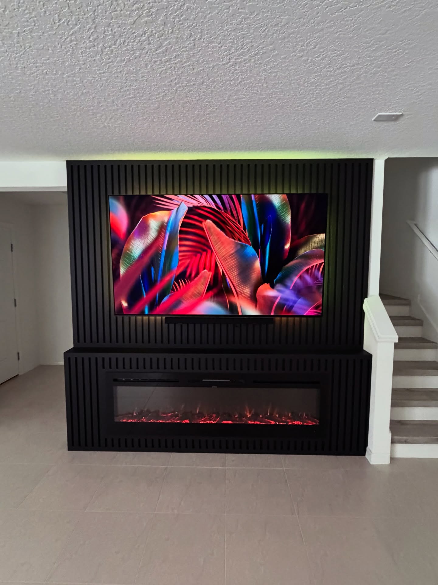 Slat-wall TV feature with hidden wiring by AVP Construction JAX — Jacksonville & St. John's County, FL