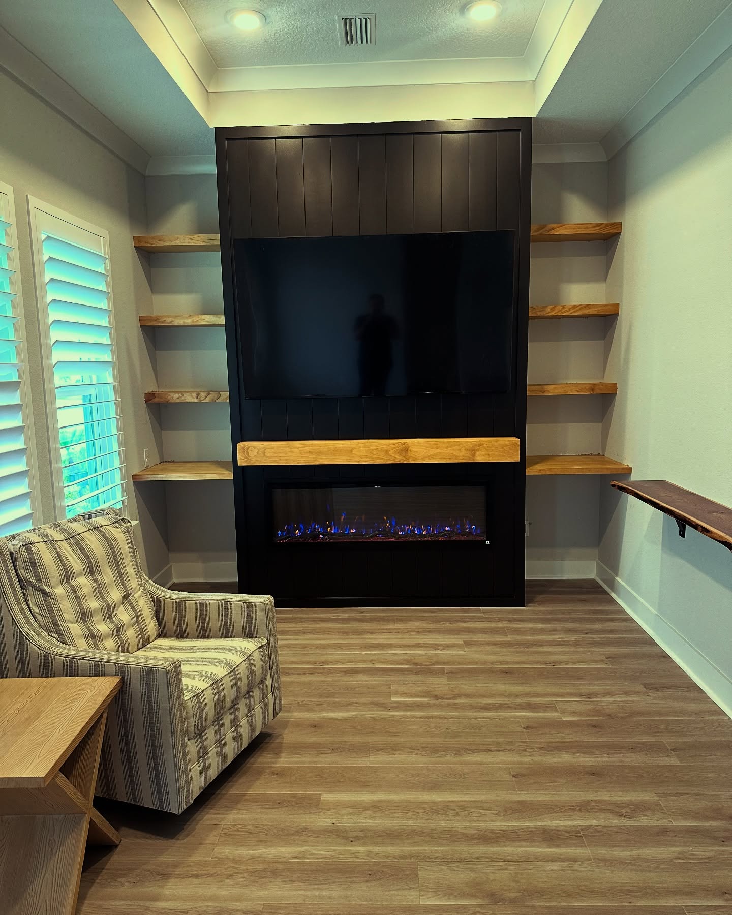 Floor-to-ceiling media wall with custom millwork by AVP Construction JAX — Jacksonville & St. John's County, FL