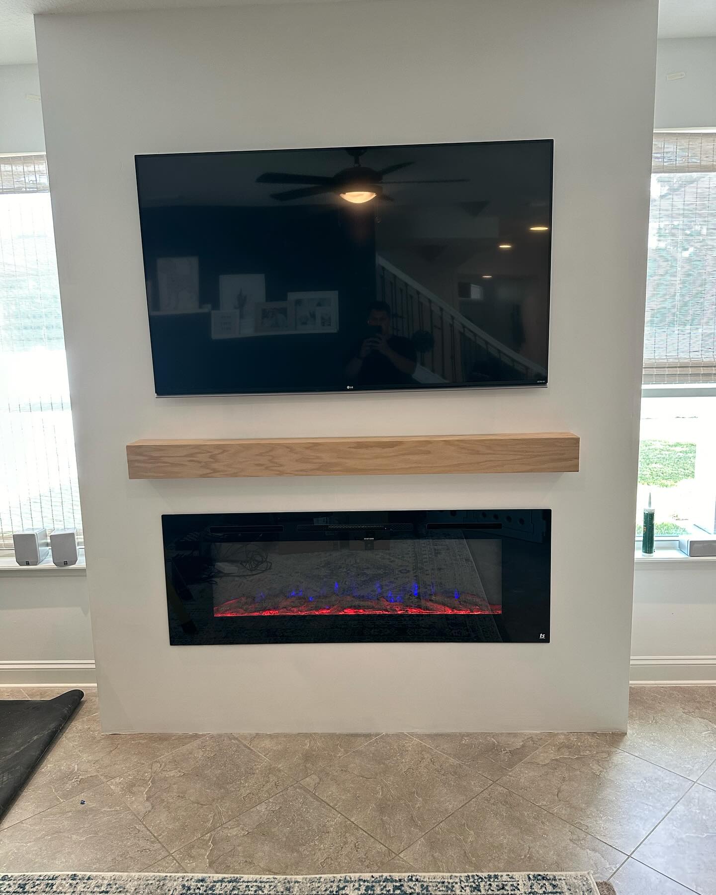 Built-in TV cabinet flanked by display shelving by AVP Construction JAX — Jacksonville & St. John's County, FL