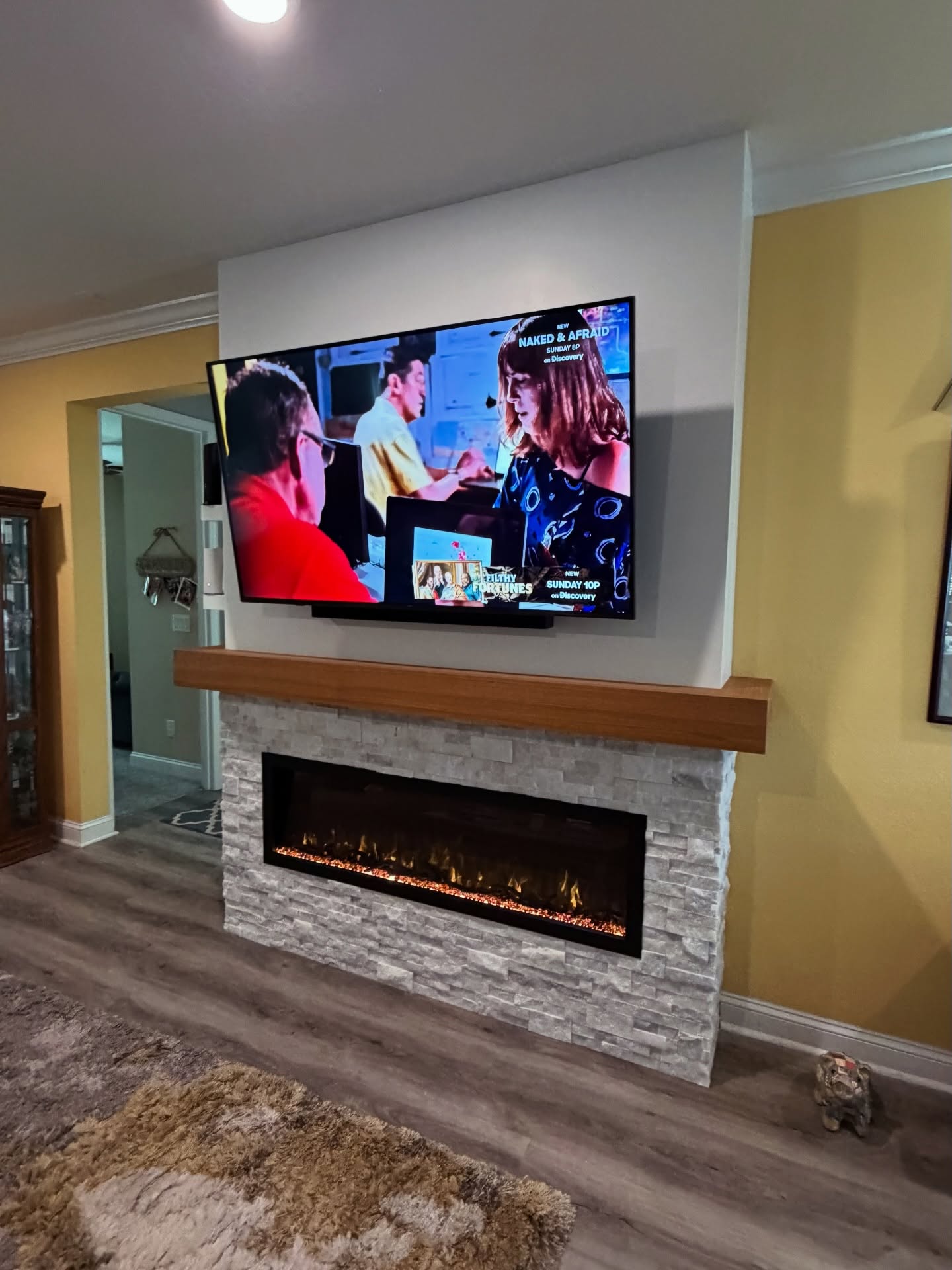 Slat-wall TV feature with hidden wiring by AVP Construction JAX — Jacksonville & St. John's County, FL