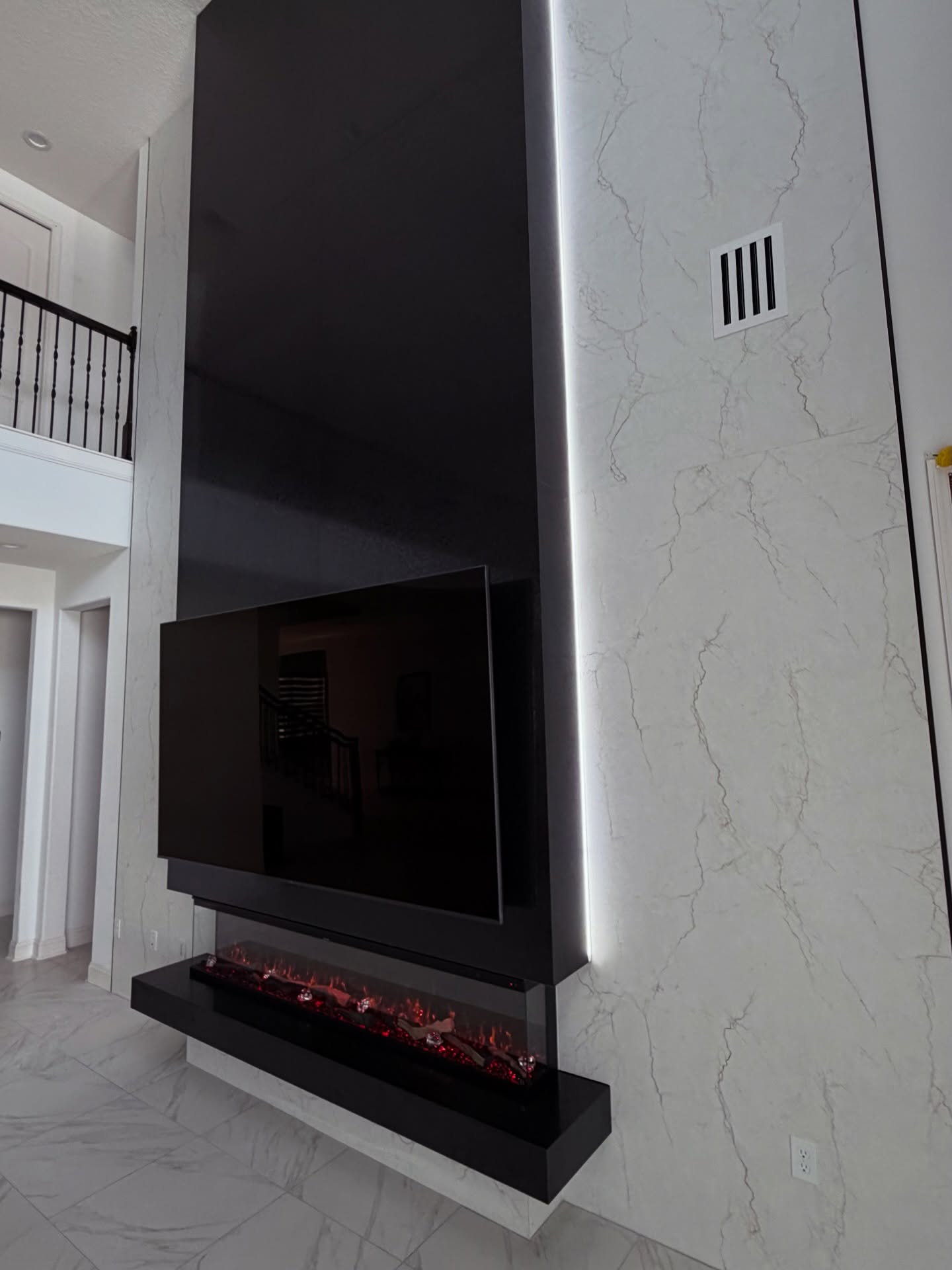 Floating-shelf TV built-in with shaker cabinets by AVP Construction JAX — Jacksonville & St. John's County, FL