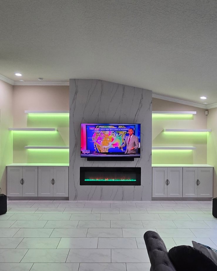 Built-in TV cabinet flanked by display shelving by AVP Construction JAX — Jacksonville & St. John's County, FL
