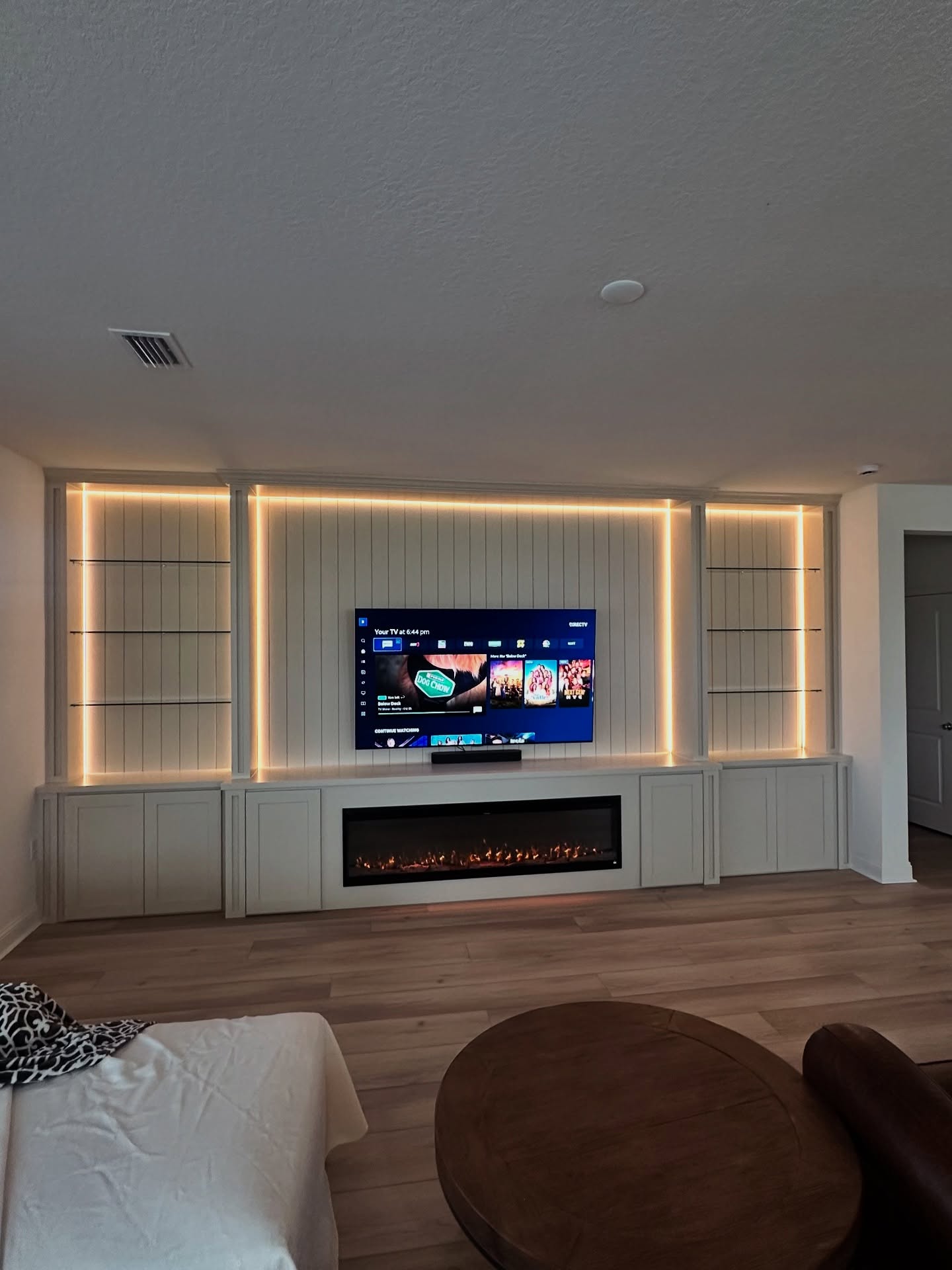 Slat-wall TV feature with hidden wiring by AVP Construction JAX — Jacksonville & St. John's County, FL