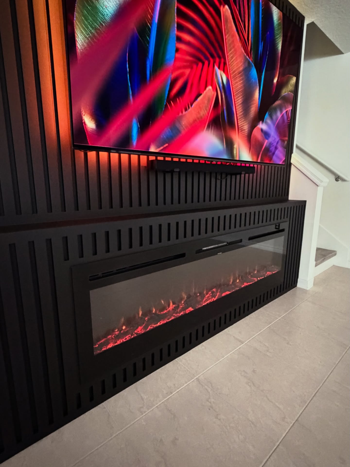 Wall-mounted TV with under-cabinet storage by AVP Construction JAX — Jacksonville & St. John's County, FL