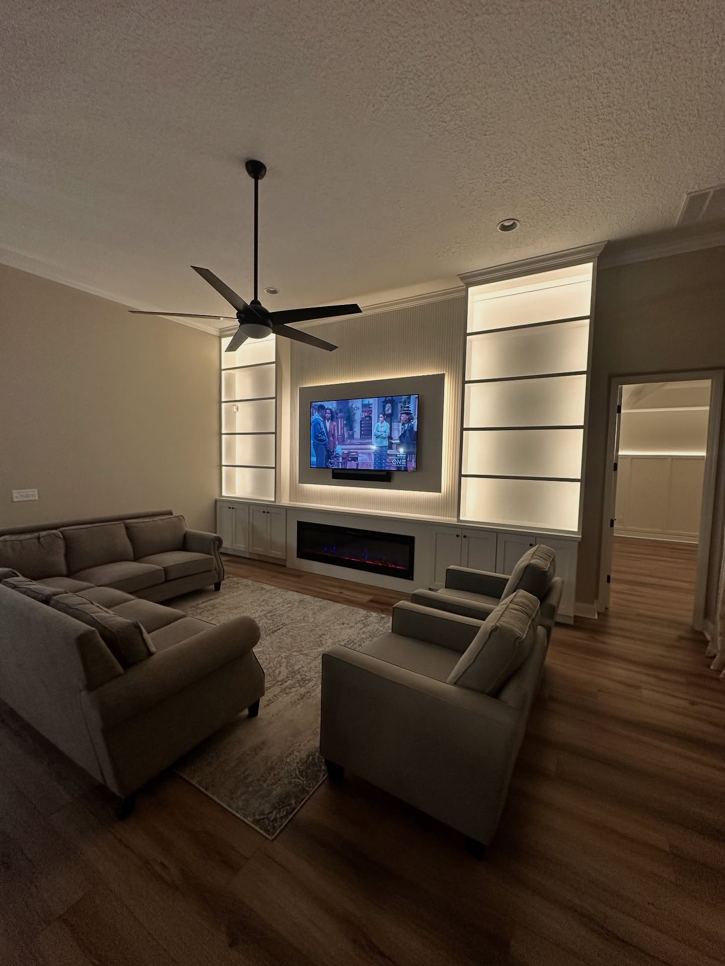 Built-in TV cabinet flanked by display shelving by AVP Construction JAX — Jacksonville & St. John's County, FL