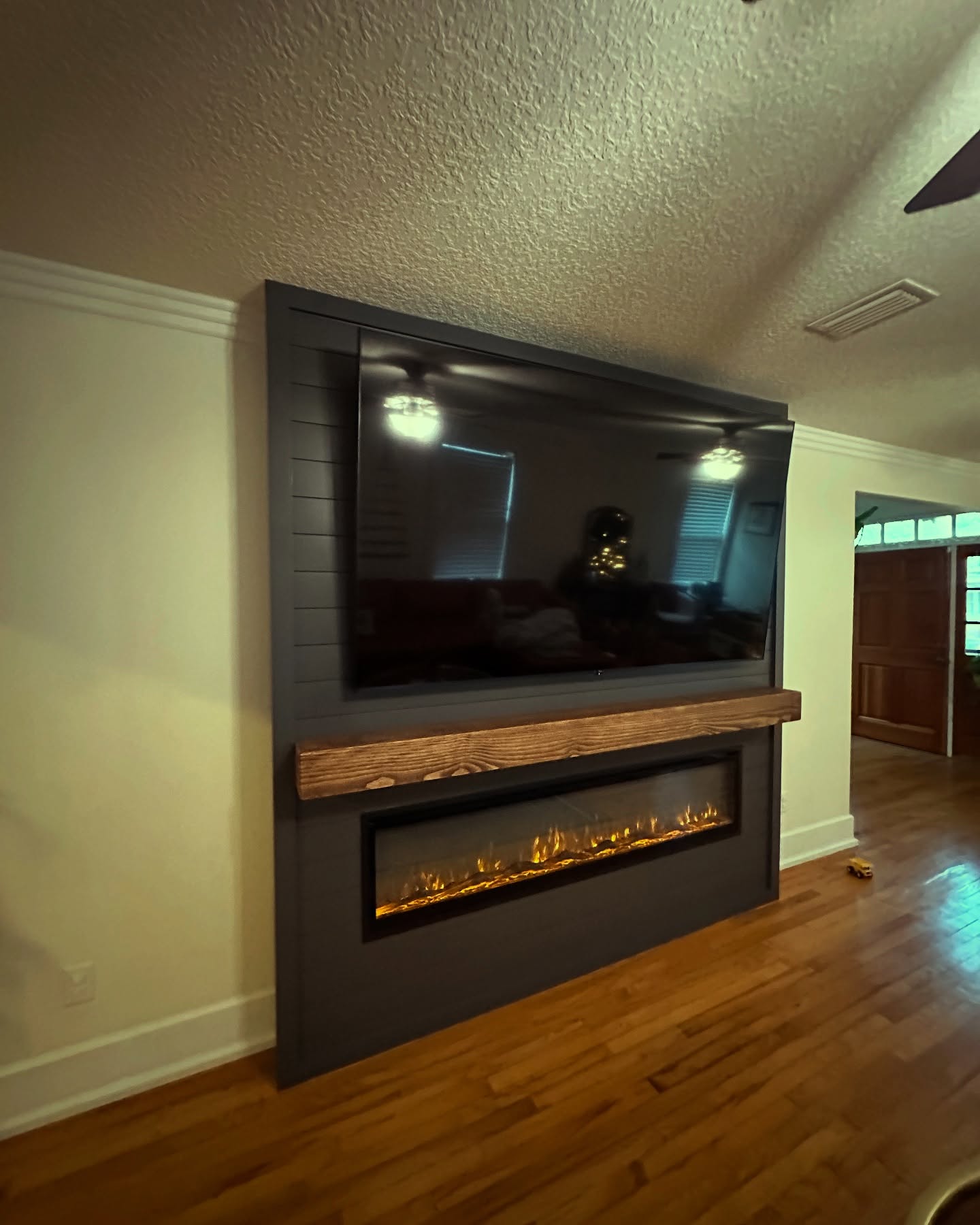 Custom TV entertainment center built-in by AVP Construction JAX — Jacksonville & St. John's County, FL