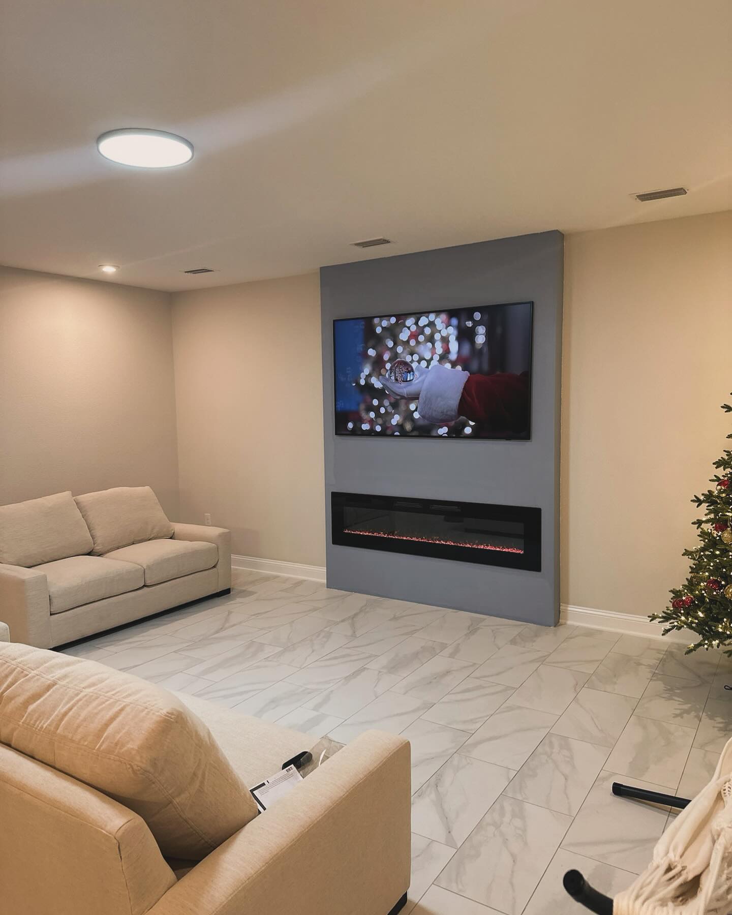 Floor-to-ceiling media wall with custom millwork by AVP Construction JAX — Jacksonville & St. John's County, FL
