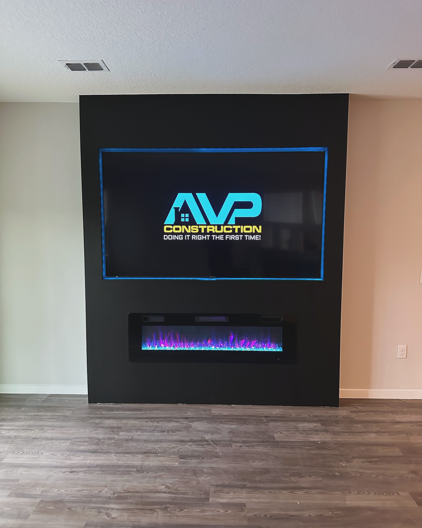 Floating-shelf TV built-in with shaker cabinets by AVP Construction JAX — Jacksonville & St. John's County, FL