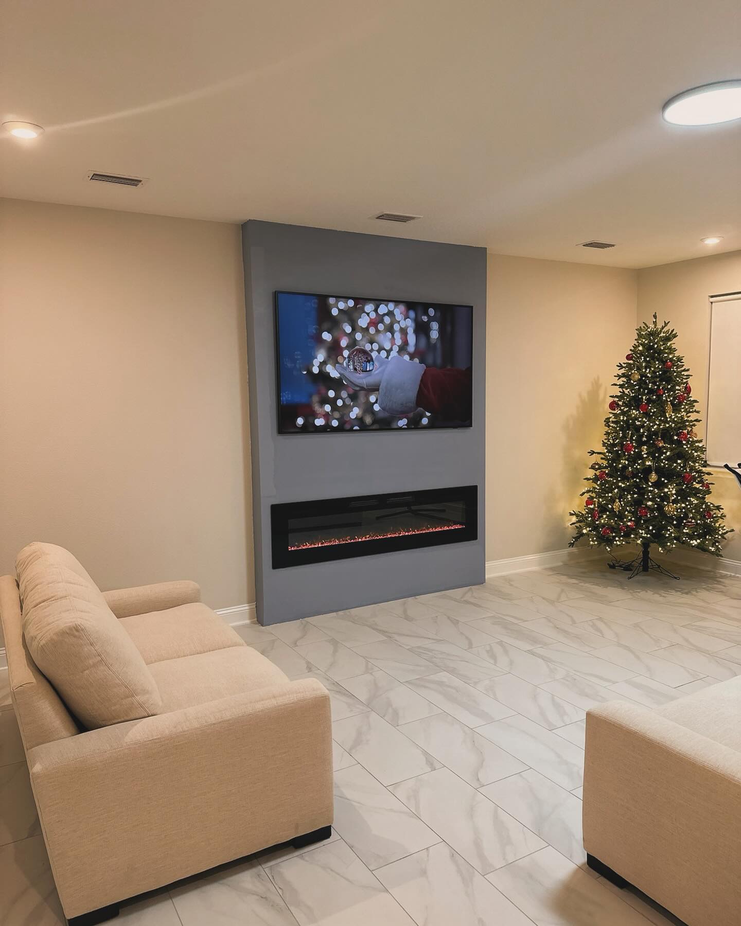 Modern entertainment center with electric fireplace by AVP Construction JAX — Jacksonville & St. John's County, FL