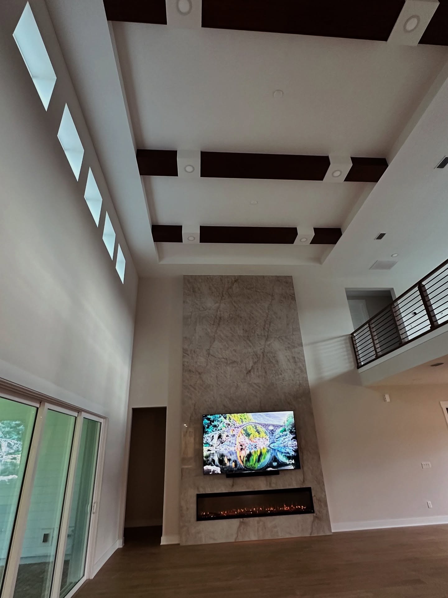 Built-in TV cabinet flanked by display shelving by AVP Construction JAX — Jacksonville & St. John's County, FL